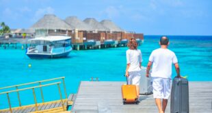 Man and woman walks on the dock for their vacation