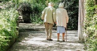 A senior couple walking together