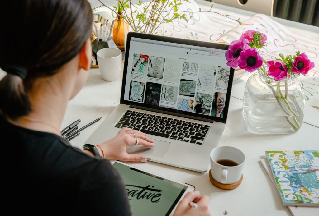 A woman creating a website with custom web development